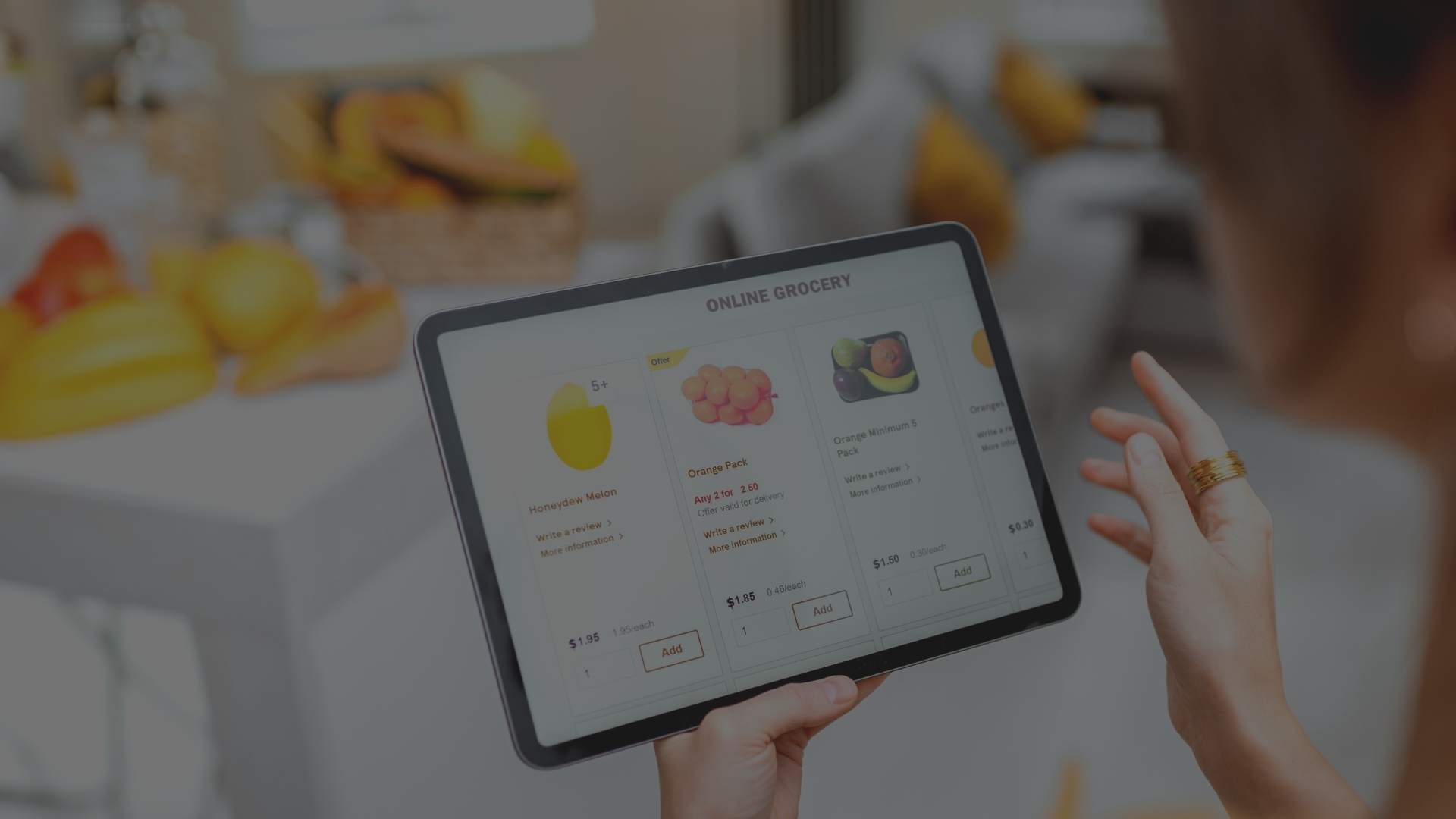 hands holding tablet showing online fruits purchase