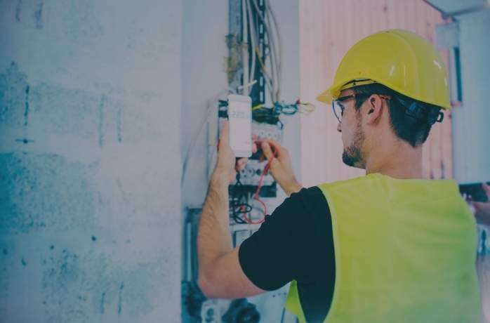 technician inspecting elevator cables