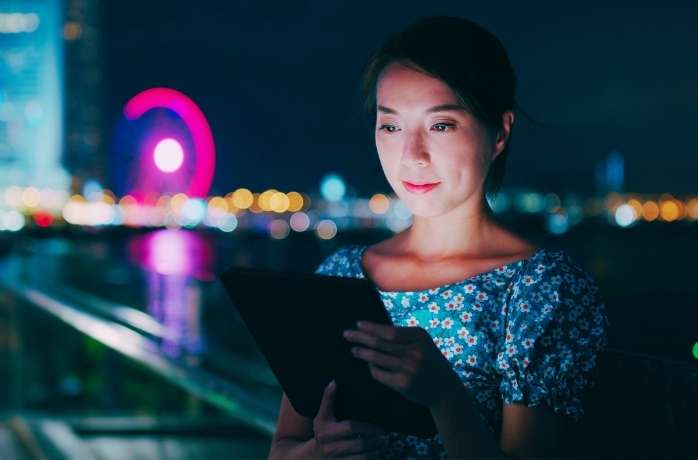 young woman looking at tablet