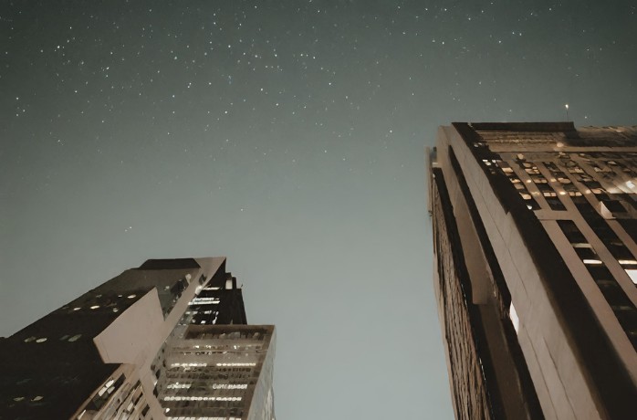 tall buildings view with stars in the sky