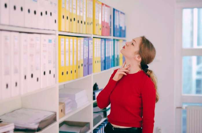 lady looking at document folders